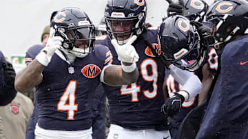 Nov 9, 2025; Chicago, Illinois, USA; Chicago Bears running back D'Andre Swift (4) celebrates after a first down during the first half against the New York Giants at Soldier Field.