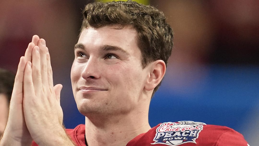 Jan 9, 2026; Atlanta, GA, USA; Indiana Hoosiers quarterback Fernando Mendoza (15) reacts after the 2025 Peach Bowl and semifinal game of the College Football Playoff at Mercedes-Benz Stadium. Mandatory Credit: Dale Zanine-Imagn Images