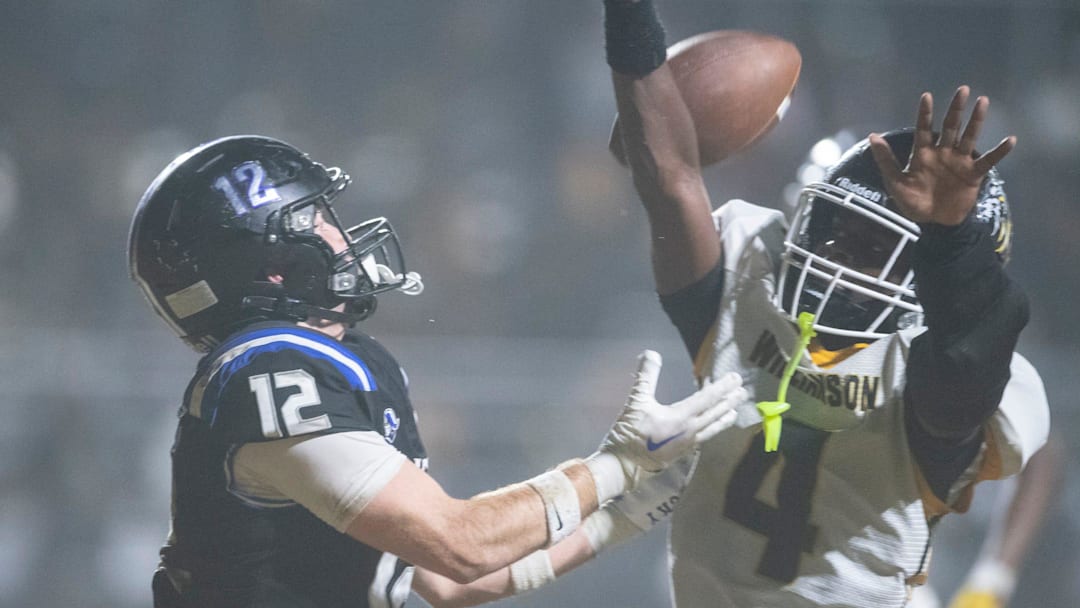 Williamson's Jaylen Scott (4) breaks up a pass intended for Montgomery Catholic's Michael Sheffield (12) during the AHSAA football playoffs at Montgomery Preparatory School in Montgomery, Ala. on Friday, Nov. 21, 2025. 
