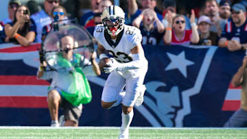 New Orleans Saints cornerback Marshon Lattimore (23) intercepts a pass against New England Patriots