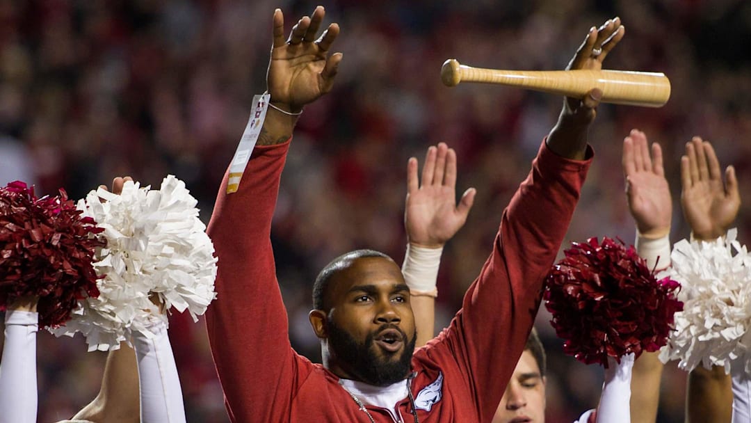 Two-time Heisman Trophy runnerup Darren McFadden "brings the wood" while being honored Nov. 12, 2016, during a break in the Arkansas Razorbacks game against the LSU Tigers at Donald W. Reynolds Razorback Stadium. 