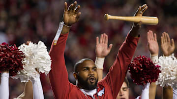 Two-time Heisman Trophy runnerup Darren McFadden "brings the wood" while being honored Nov. 12, 2016, during a break in the Arkansas Razorbacks game against the LSU Tigers at Donald W. Reynolds Razorback Stadium. 