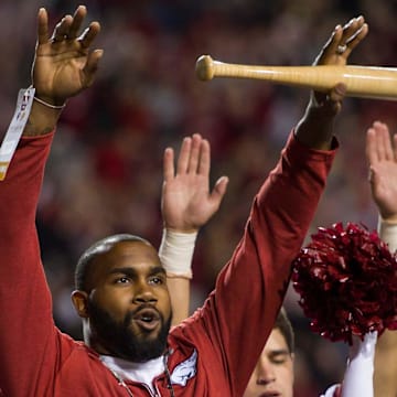 Two-time Heisman Trophy runnerup Darren McFadden "brings the wood" while being honored Nov. 12, 2016, during a break in the Arkansas Razorbacks game against the LSU Tigers at Donald W. Reynolds Razorback Stadium. 