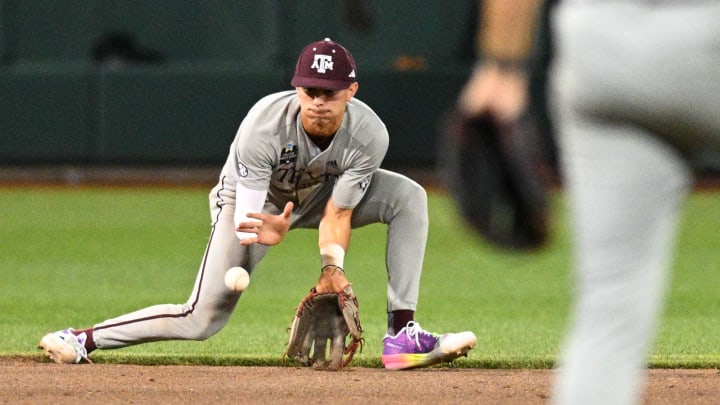 Jun 22, 2024; Omaha, NE, USA;  Texas A&M Aggies shortstop Ali Camarillo (2) makes a play against the Tennessee Volunteers to end the sixth inning at Charles Schwab Field Omaha. Mandatory Credit: Steven Branscombe-USA TODAY Sports