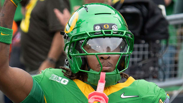 Oregon Ducks Dakorien Moore Jeremiah Smith Ohio State Buckeyes NIL Recruiting Dan Lanning Evan Stewart College Football NIL 
