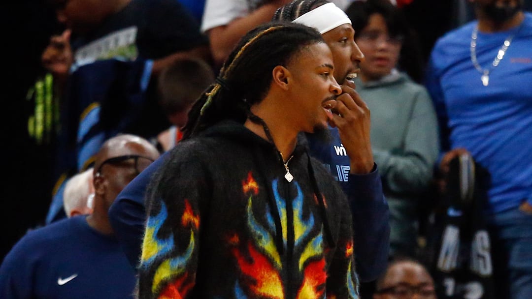 Oct 6, 2025; Memphis, Tennessee, USA; Memphis Grizzlies guard Ja Morant (12) looks on during the fourth quarter against the Detroit Pistons at FedExForum. Mandatory Credit: Petre Thomas-Imagn Images