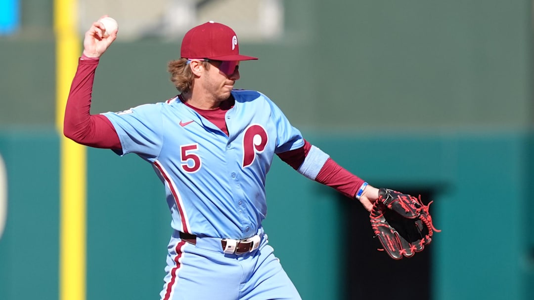 Apr 17, 2025; Philadelphia, Pennsylvania, USA; Philadelphia Phillies infielder Bryson Stott (5) throws to first against the San Francisco Giants in the second inning at Citizens Bank Park.