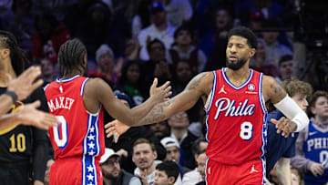 Jan 24, 2025; Philadelphia, Pennsylvania, USA; Philadelphia 76ers forward Paul George (8) high fives guard Tyrese Maxey (0) after scoring during the fourth quarter against the Cleveland Cavaliers at Wells Fargo Center. Mandatory Credit: Bill Streicher-Imagn Images
