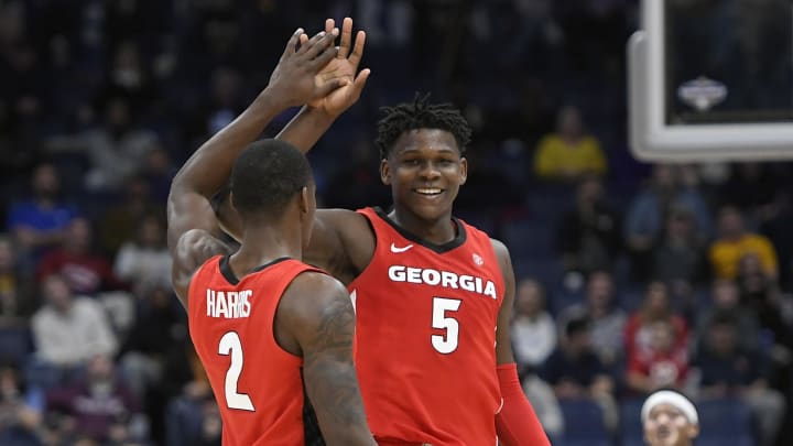 Mar 11, 2020; Nashville, Tennessee, USA;  Georgia Bulldogs guard Anthony Edwards (5) and guard Jordan Harris (2) celebrate after defeating the Mississippi Rebels in the SEC conference tournament at Bridgestone Arena. 