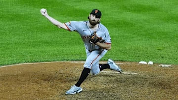 Sep 2, 2025; Denver, Colorado, USA; San Francisco Giants relief pitcher Ryan Walker (74) delivers a pitch in the ninth inning against the Colorado Rockies at Coors Field. Mandatory Credit: Ron Chenoy-Imagn Images