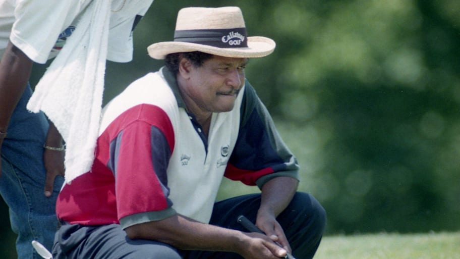Jim Dent and son Jim Jr. look over a putt during the 1995 BellSouth Senior Classic at Opryland.