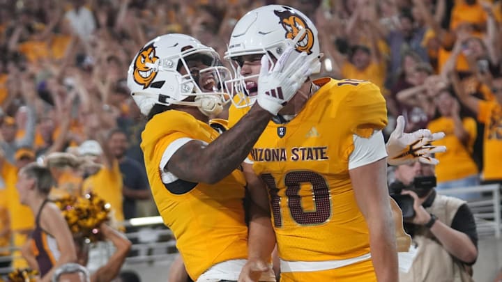 ASU Sun Devils quarterback Sam Leavitt (10) celebrates his touchdown run with teammate Jordyn Tyson (0) against the Mississippi State Bulldogs at Mountain America Stadium in Tempe on Sept. 7, 2024.