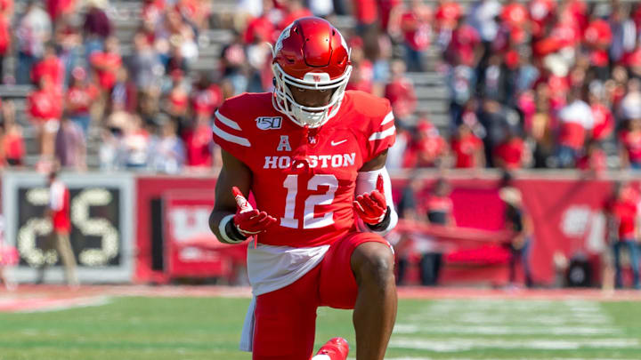 Oct 12, 2019; Houston, TX, USA; Houston Cougars defensive lineman David Anenih (12) kneels after the run out prior to the game between Houston Cougars and Cincinnati Bearcats at TDECU Stadium. Mandatory Credit: Maria Lysaker-Imagn Images Oct 12, 2019; Houston, TX, USA; Houston Cougars defensive lineman David Anenih (12) kneels after the run out prior to the game between Houston Cougars and Cincinnati Bearcats at TDECU Stadium. Mandatory Credit: Maria Lysaker-Imagn Images