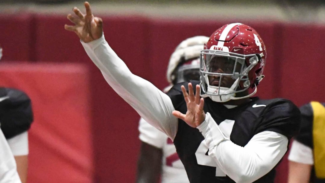 April 9, 2024; Tuscaloosa, Alabama, USA; Alabama quarterback Jalen Milroe (4) throws during practice in the Hank Crisp Indoor Practice Facility at the University of Alabama.