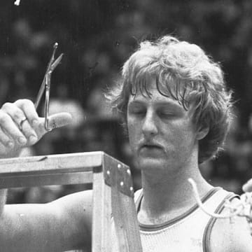 Larry Bird cuts down the net after Indiana State University won the championship game in the Missouri Valley tournament on March 3, 1979. Bird suffered a triple hairline fracture of his left thumb in the game. That year ISU faced Michigan State in the NCAA finals but lost to the Spartans (and Magic Johnson) on March 26,1979,in Salt Lake City.

Bird