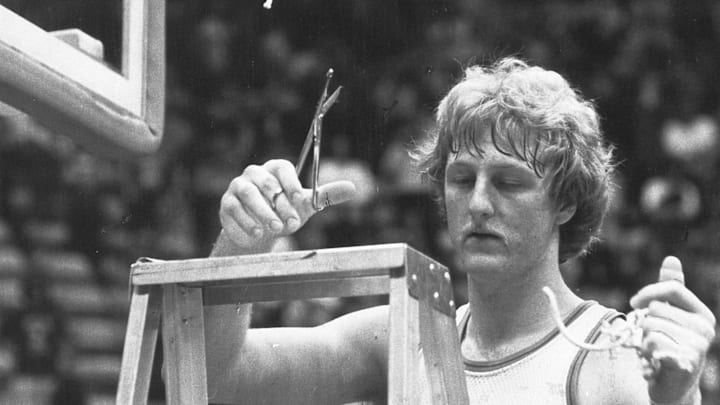 Larry Bird cuts down the net after Indiana State University won the championship game in the Missouri Valley tournament on March 3, 1979. Bird suffered a triple hairline fracture of his left thumb in the game. That year ISU faced Michigan State in the NCAA finals but lost to the Spartans (and Magic Johnson) on March 26,1979,in Salt Lake City.

Bird