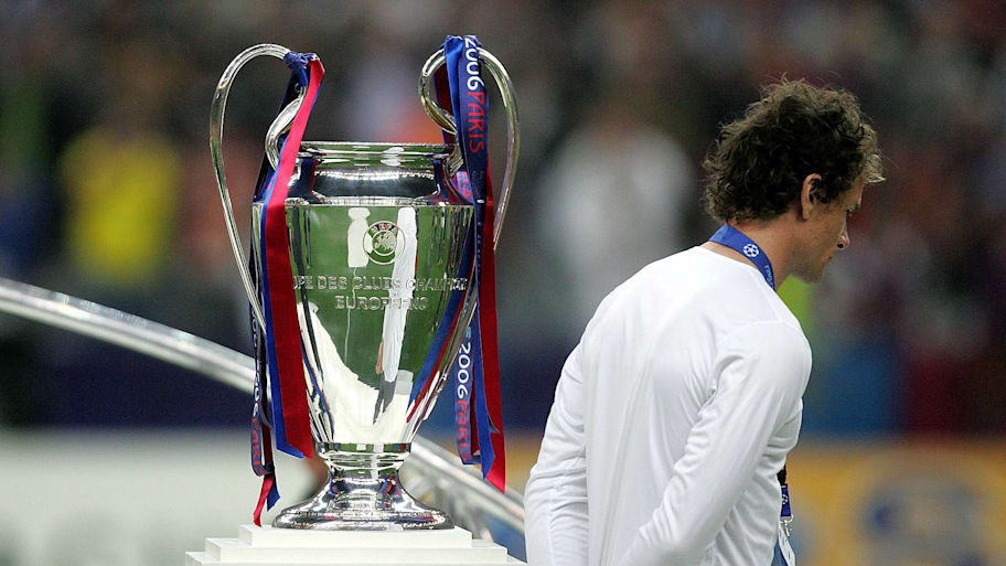 Jens Lehmann walks past the Champions League trophy in 2006.