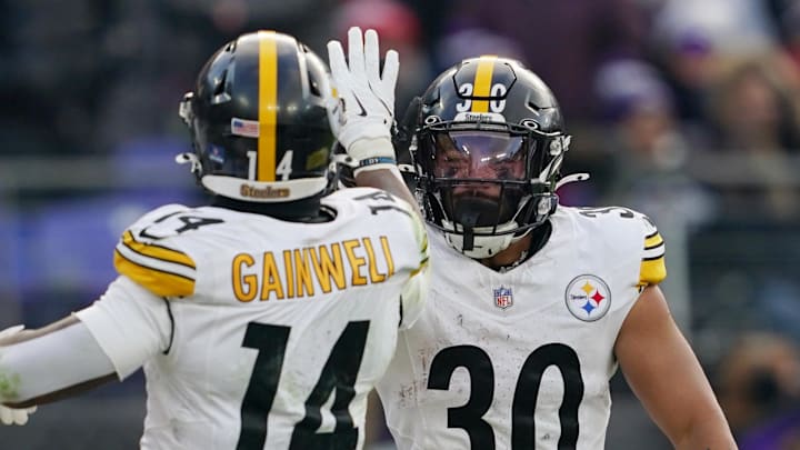 Pittsburgh Steelers running backs Jaylen Warren (30) and Kenneth Gainwell (14)  face the Baltimore Ravens in Week 18.