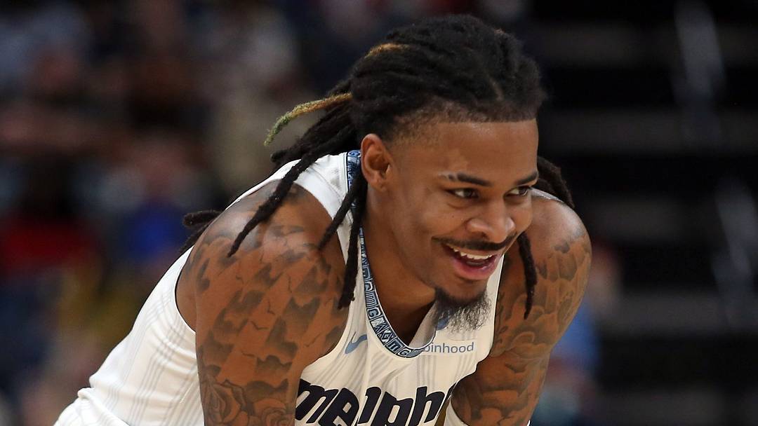 Dec 26, 2025; Memphis, Tennessee, USA; Memphis Grizzlies guard Ja Morant (12) reacts during the second quarter against the Milwaukee Bucks at FedExForum. Mandatory Credit: Petre Thomas-Imagn Images