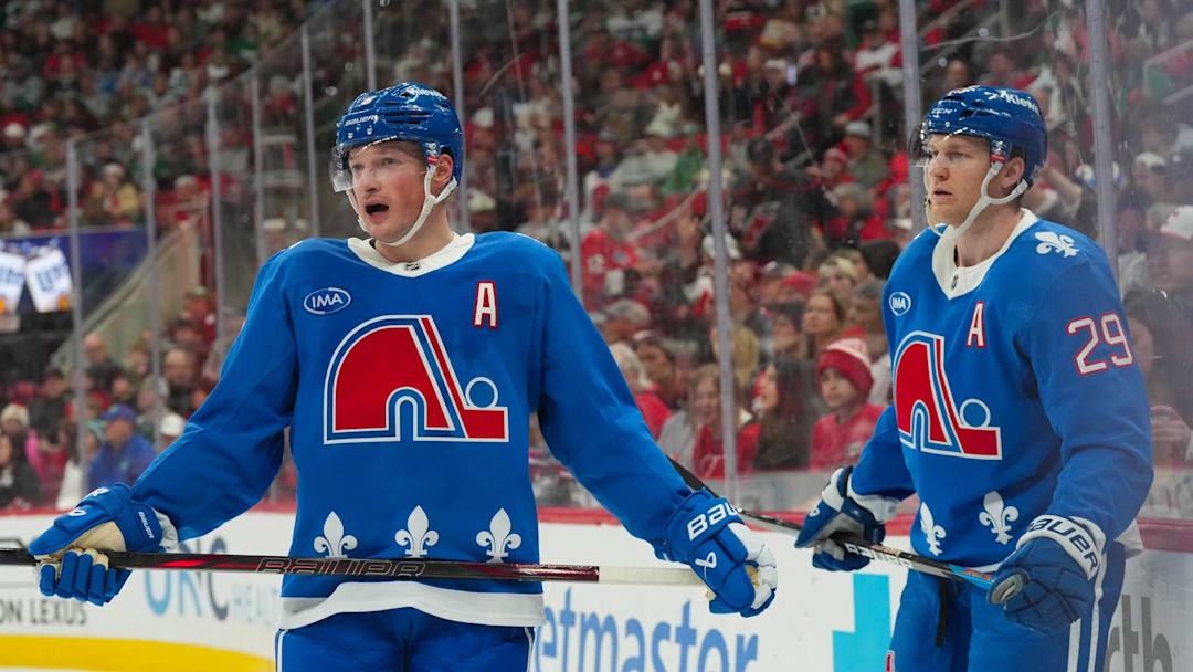 Jan 3, 2026; Raleigh, North Carolina, USA; Colorado Avalanche defenseman Cale Makar (8) and center Nathan MacKinnon (29) look on during the third period against the Carolina Hurricanes at Lenovo Center. Mandatory Credit: James Guillory-Imagn Images