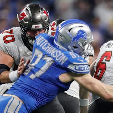 Detroit Lions defensive end Aidan Hutchinson (97) tackles Tampa Bay Buccaneers quarterback Baker Mayfield (6)