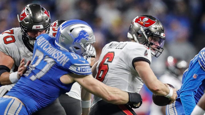 Detroit Lions defensive end Aidan Hutchinson (97) tackles Tampa Bay Buccaneers quarterback Baker Mayfield (6)