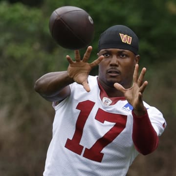 Jun 5, 2024; Ashburn, VA, USA; Washington Commanders wide receiver Terry McLaurin (17) catches a ball during warmup prior to an OTA workout at Commanders Park. Mandatory Credit: Geoff Burke-USA TODAY Sports