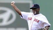 Jul 20, 2013; Boston, MA, USA; Boston Red Sox former pitcher Luis Tiant throws out the first pitch prior to a game against the New York Yankees at Fenway Park. Mandatory Credit: Bob DeChiara-Imagn Images