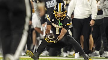 Missouri Tigers wide receiver Donovan Olugbode (1) catches a pass in a game against the Texas A&M Aggies this season.