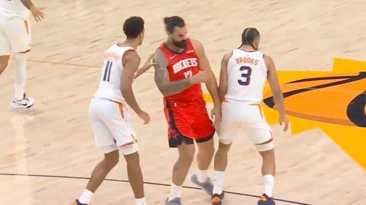 Dillon Brooks shoulder checks former teammate Steven Adams.