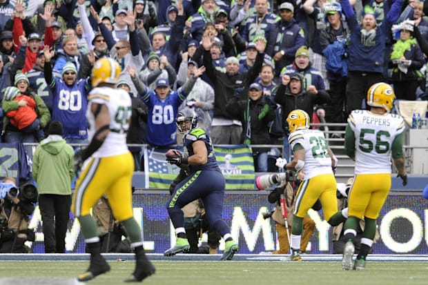 Seattle Seahawks tackle Garry Gilliam (79) catches a 19 yard touchdown pass on a fake field goal.
