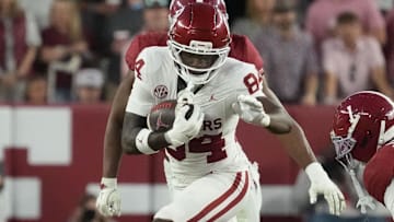 Oklahoma Sooners wide receiver Jer'Michael Carter (84) tries to avoid a tackle by Alabama Crimson Tide defensive back Domani Jackson (1) at Saban Field at Bryant-Denny Stadium. Oklahoma defeated Alabama 23-21. 