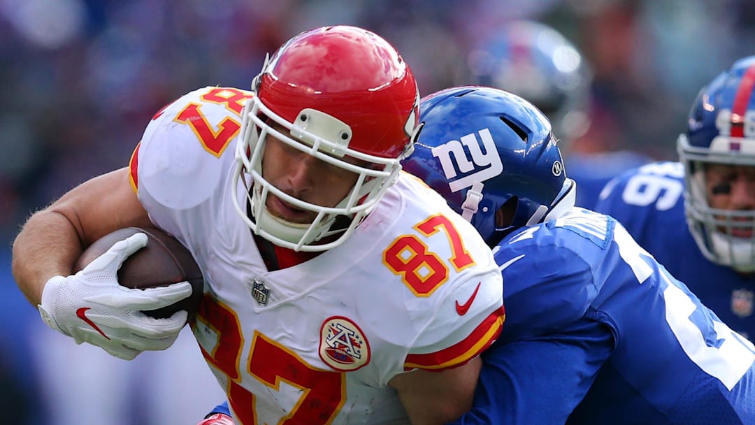 Nov 19, 2017; East Rutherford, NJ, USA; Kansas City Chiefs tight end Travis Kelce (87) is tackled by New York Giants safety Darian Thompson (27) during the second quarter at MetLife Stadium. Mandatory Credit: Brad Penner-Imagn Images