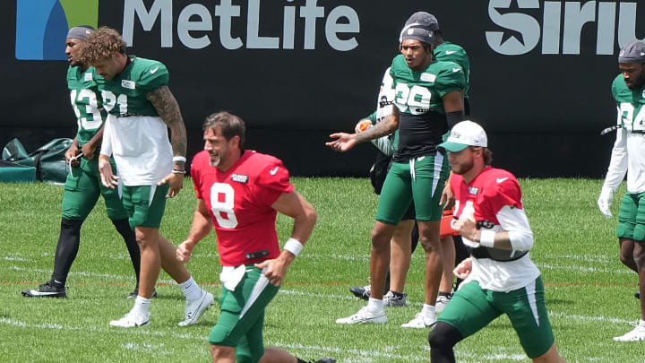 Florham Park, NJ -- August 21, 2024 -- Jets quarterbacks Aaron Rodgers and Andrew Peasley during practice. The New York Giants came to the Atlantic Health Jets Training Center in Florham Park, New Jersey to take part in a joint practice with the New York Jets.