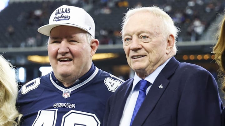 Jan 5, 2025; Arlington, Texas, USA;  Dallas Cowboys owner Jerry Jones (right) takes a photo with former player Bill Bates (left) before the game against the Washington Commanders at AT&T Stadium. Mandatory Credit: Kevin Jairaj-Imagn Images