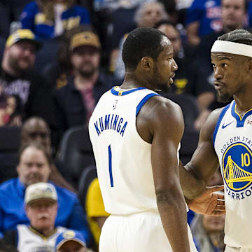 Oct 8, 2025; San Francisco, California, USA;  Golden State Warriors forward Jimmy Butler III (10) reacts  towards forward Jonathan Kuminga (1) during the second quarter against the Portland Trail Blazers at Chase Center. Mandatory Credit: John Hefti-Imagn Images