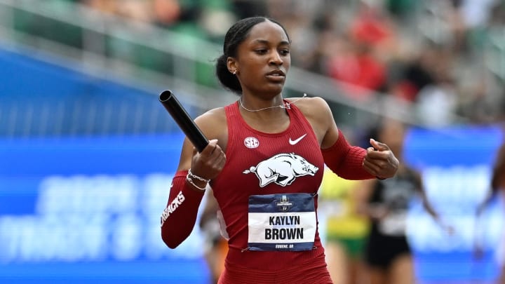 Kaylyn Brown of Arkansas crosses the finish line in the 4x400m in 3:17.96 to set a new collegiate record during the NCAA Track and Field Championships at Hayward Field. 