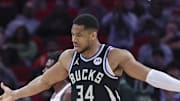 Feb 25, 2025; Houston, Texas, USA; Milwaukee Bucks center Brook Lopez (11) reacts with forward Giannis Antetokounmpo (34) after a play during the first quarter against the Houston Rockets at Toyota Center. Mandatory Credit: Troy Taormina-Imagn Images