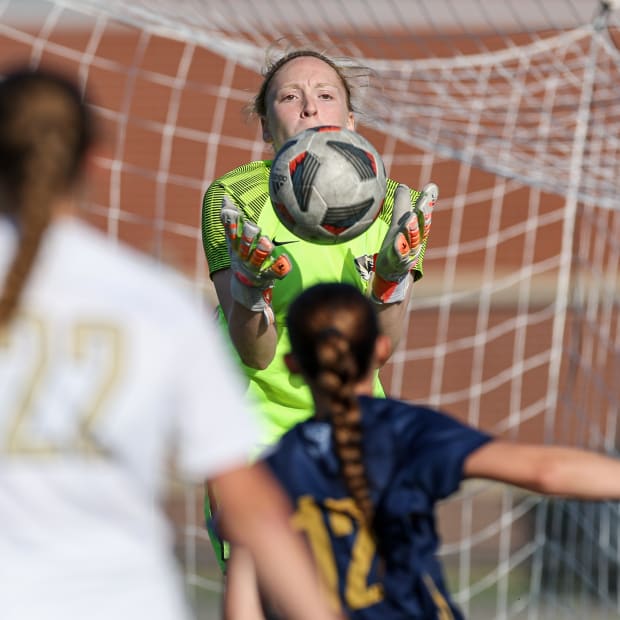 Goalie Avery Rausch of Lee's Summit (Mo.) makes a save during a MSHSAA Class 4 quarterfinal match against Liberty North.