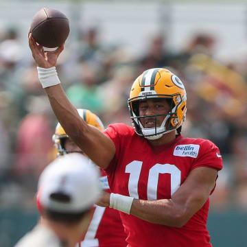 Green Bay Packers QB Jordan Love passes the ball at training camp.