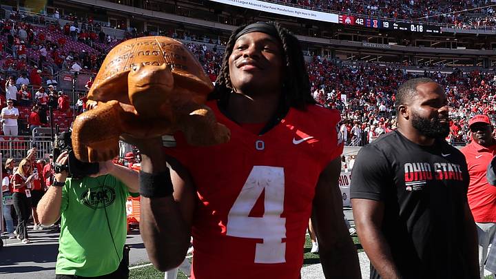 Sep 26, 2026; Columbus, Ohio, USA;  Ohio State Buckeyes wide receiver Jeremiah Smith (4) with Illibuck, a trophy awarded to the winner of the college football rivalry between the Illinois Fighting Illini and the Buckeyes, after the game at Ohio Stadium.  Mandatory Credit: Joseph Maiorana-Imagn Images