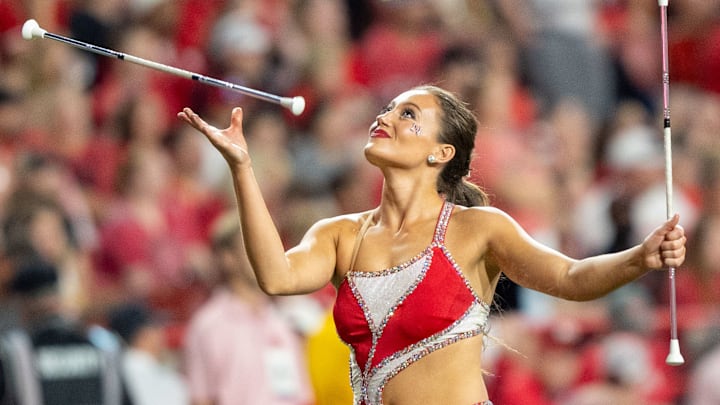 A baton twirler performs during halftime of the Nebraska-Northern Iowa game.