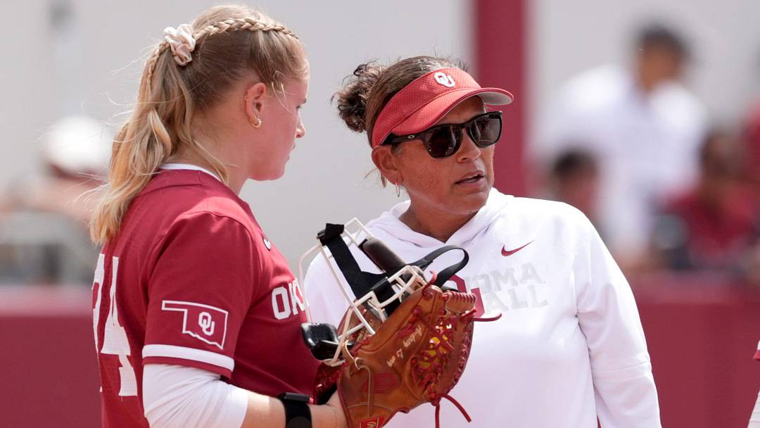Oklahoma Associate Head Coach head Jennifer Rocha talks with Audrey Lowry (24) during the NCAA Norman Softball Regional game between the University of Oklahoma Sooners and Michigan Wolverines at Love's Field in Norman, Okla., May, 17, 2026.