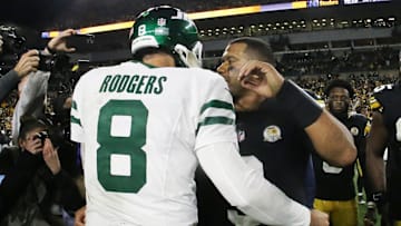 Oct 20, 2024; Pittsburgh, Pennsylvania, USA;  New York Jets quarterback Aaron Rodgers (8) and Pittsburgh Steelers quarterback Russell Wilson (right) greet each other after their game at Acrisure Stadium. Mandatory Credit: Charles LeClaire-Imagn Images