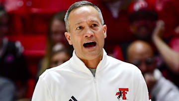 Jan 4, 2025; Salt Lake City, Utah, USA; Texas Tech Red Raiders head coach Grant McCasland reacts on the court during the second half against the Utah Utes at the Jon M. Huntsman Center. Mandatory Credit: Christopher Creveling-Imagn Images