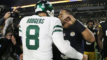 Oct 20, 2024; Pittsburgh, Pennsylvania, USA;  New York Jets quarterback Aaron Rodgers (8) and Pittsburgh Steelers quarterback Russell Wilson (right) greet each other after their game at Acrisure Stadium. Mandatory Credit: Charles LeClaire-Imagn Images
