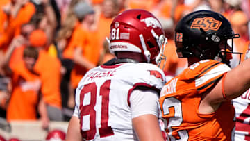 Oklahoma State's Jeff Roberson (22) celebrates the game-winning defensive stop in front of Arkansas' Andreas Paaske (81) and Luke Buchanan (84) in double over time of the college football game between the Oklahoma State Cowboys and the Arkansas Razorbacks at Boone Pickens Stadium in Stillwater, Okla.,, Saturday, Sept., 7, 2024.