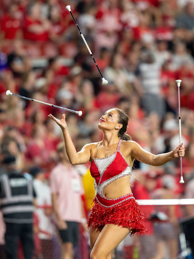 A baton twirler performs during halftime of the Nebraska-Northern Iowa game.