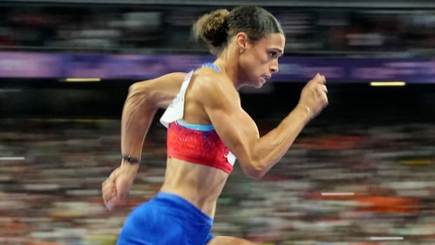 Close-up of Sydney McLaughin-Levrone running the 400-meter hurdles at the Paris Olympics.