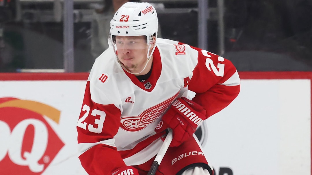 Jan 1, 2026; Pittsburgh, Pennsylvania, USA;  Detroit Red Wings left wing Lucas Raymond (23) skates with the puck against the Pittsburgh Penguins during the third period at PPG Paints Arena. Mandatory Credit: Charles LeClaire-Imagn Images